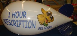 blimp - 11 ft. advertising blimp with one Hour Optical logo